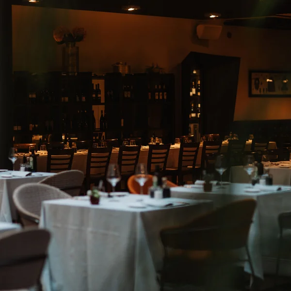 Elegant restaurant with set tables and dim lighting