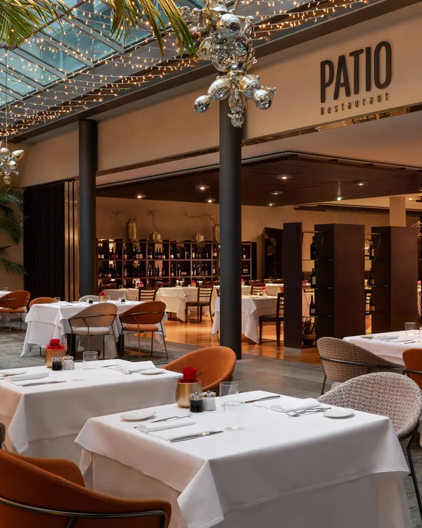 Elegant restaurant with set tables and decorative ceiling lights